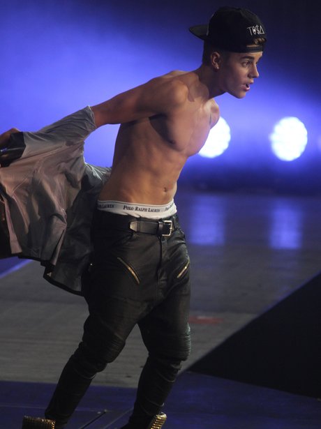 Justin Bieber performs topless
