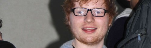 Ed Sheeran wearing glasses at LAX airport