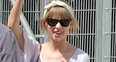 Taylro Swift waving at fans