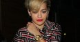 Rita Ora wearing white knee high boots