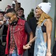 Rihanna holding hands with her brother